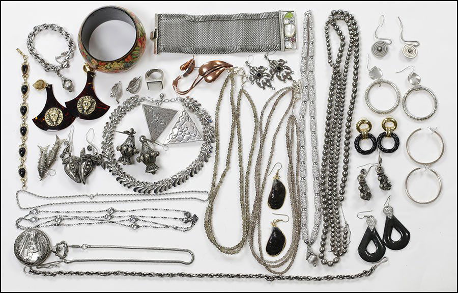 A COLLECTION OF SILVERTONE JEWELRY.: A COLLECTION OF SILVERTONE JEWELRY. Comprising bracelets, necklaces, rings, earclips, brooches, and postback earrings. Signed pieces including Trifari, Monet, Matisse, and Kenneth Cole