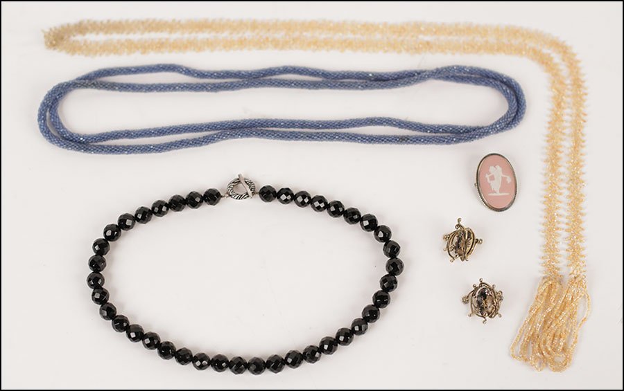 A BLACK JET BEAD NECKLACE.: A BLACK JET BEAD NECKLACE. With a sterling silver clasp. Together with two seed bead necklaces, a Wedgwood pink jasperware brooch, and a pair of gold tone screwback earrings