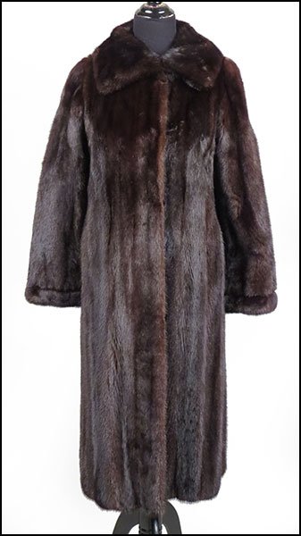 A PIERRE CARDIN FOR ROSENTHAL BLACK MINK COAT.: A PIERRE CARDIN FOR ROSENTHAL BLACK MINK COAT. Vented on either side along the sweep. Fold over cuffs and a spread collar Approximately a size 4-6