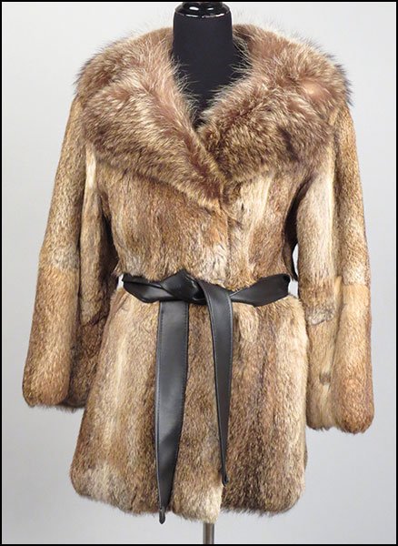 AN EVANS CHICAGO RABBIT AND RACCOON COAT.: AN EVANS CHICAGO RABBIT AND RACCOON COAT. With a leather belt