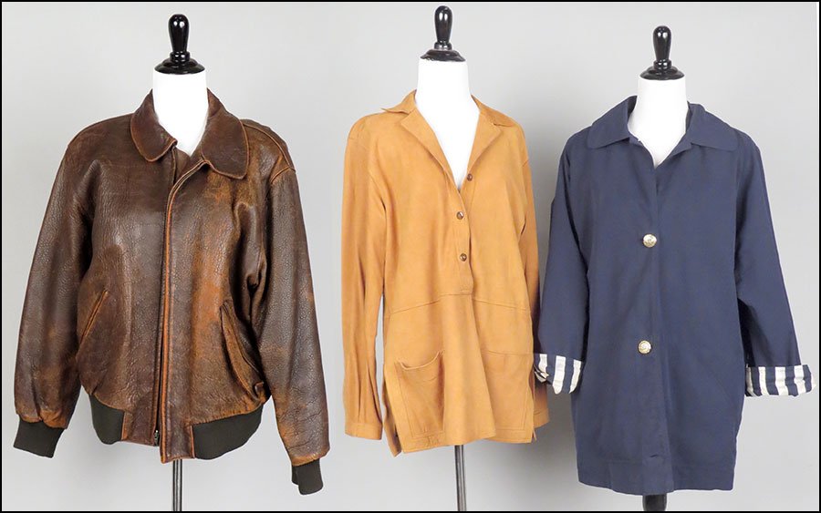 A BROOKS BROTHER'S BUTTON FRONT HOODED JACKET.: A BROOKS BROTHER'S BUTTON FRONT HOODED JACKET. Size Men's small. Together with an ultra suede tunic top (size unlabeled) and a brown leather bomber jacket (size L)