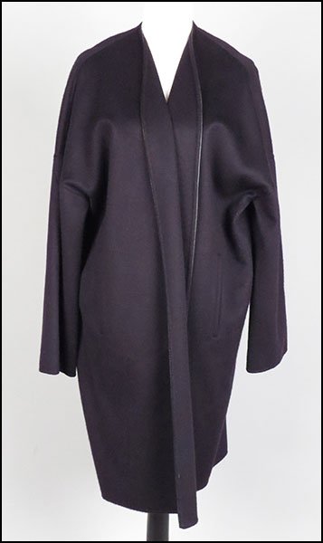AN AGNONA BLACK CASHMERE JACKET.: AN AGNONA BLACK CASHMERE JACKET. Bearing a leather trim. Size unlabeled. Provenance: From the Estate of Frances R. Dittmer