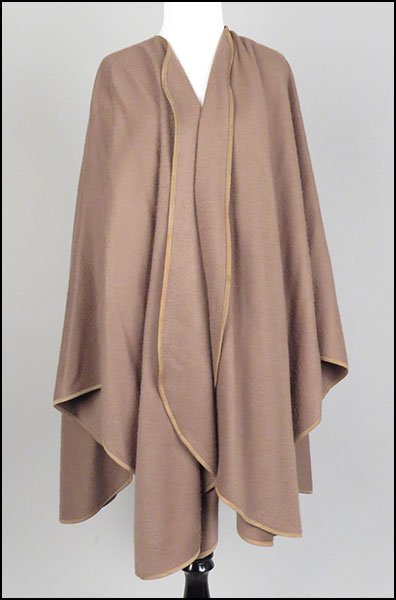 A LORO PIANA FOR NEIMAN MARCUS CAMEL CASHMERE SHAWL.: A LORO PIANA FOR NEIMAN MARCUS CAMEL CASHMERE SHAWL. Made in Italy. Bearing a leather trim. Provenance: From the Estate of Frances R. Dittmer No size