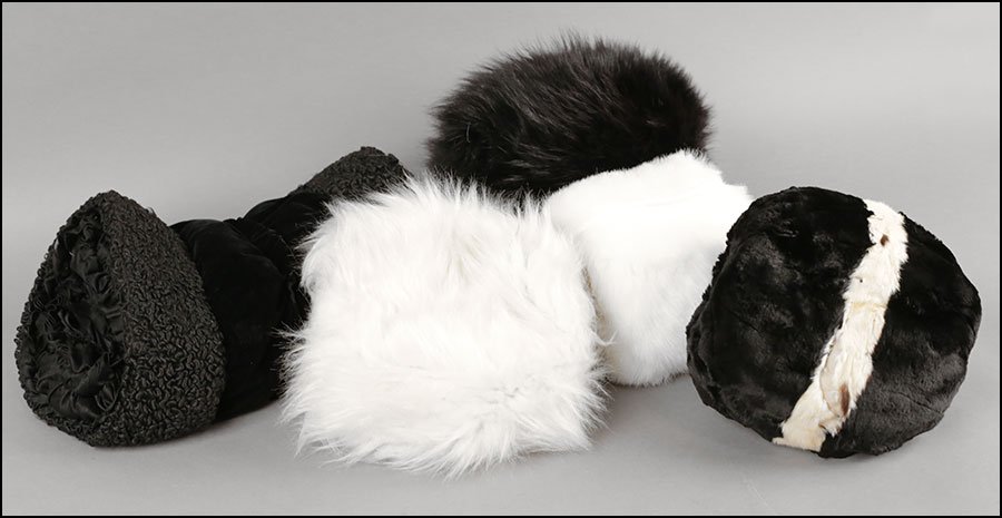 A COLLECTION OF FIVE MUFFS.: A COLLECTION OF FIVE MUFFS. One velvet, four faux fur
