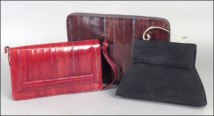 AN EEL SKIN HANDBAG.: AN EEL SKIN HANDBAG. Together with an eel skin folio, and a black Charles Jourdan suede handbag
