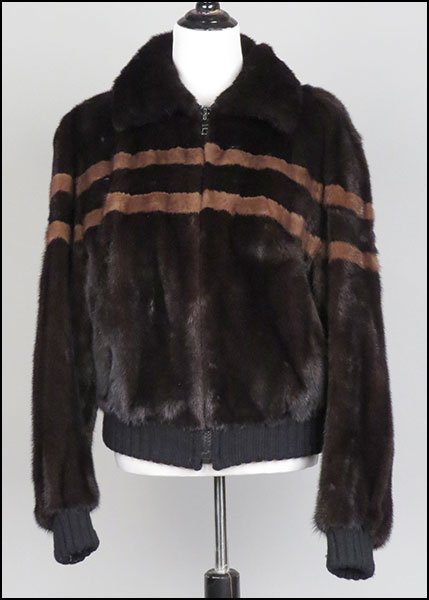 A I. MAGNIN BROWN SHEARED MINK BOMBER JACKET.: A I. MAGNIN BROWN SHEARED MINK BOMBER JACKET. Lined. Bearing a 'The Carol and Irwin Ware Fur Collection' tag. Bearing knit cuffs and a knit bottom. With lighter brown fur horizontal stripes Size unlab