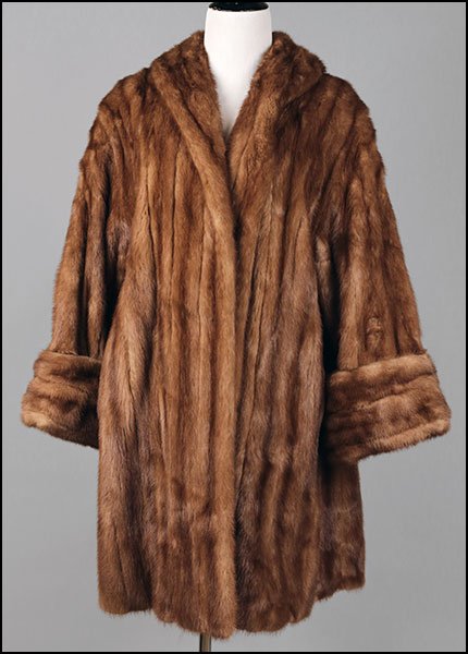 AN AUTUMN HAZE MINK SWING COAT.: AN AUTUMN HAZE MINK SWING COAT. With foldover bell cuffs, satin lined Approx. size: 6-8