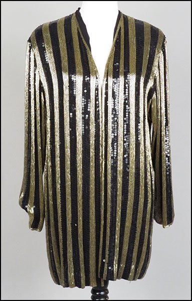AN ANNE KLEIN BLACK BEADED SILK EVENING JACKET.: AN ANNE KLEIN BLACK BEADED SILK EVENING JACKET. Alternating rows of gold bugle beads and black sequins Size medium