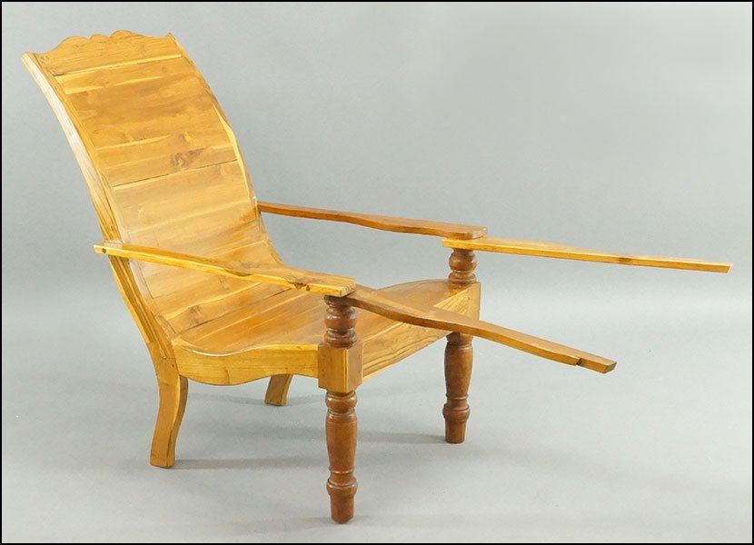 A PAIR OF INDONESIAN LOUNGE CHAIRS.: A PAIR OF INDONESIAN LOUNGE CHAIRS. Bearing swing out extendable arms 42" x 29" x 42"