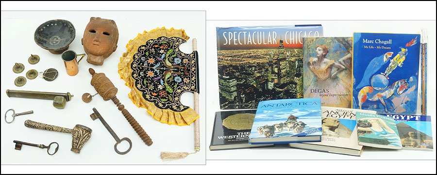 A COLLECTION OF DECORATIVE TRIBAL ITEMS.: A COLLECTION OF DECORATIVE TRIBAL ITEMS. Comprised of finger cymbals, a terracota bust, a pipe, and a bowl. Together with metal keys, a group of coffee table books, and other items