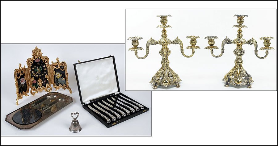 A PAIR OF SILVERPLATE THREE-LIGHT CANDELABRA.: A PAIR OF SILVERPLATE THREE-LIGHT CANDELABRA. Together with a German tryptich style gilt metal and glass clock, a set of eight stainless steel knives, a bell, and a silverplate and marble appetizer se