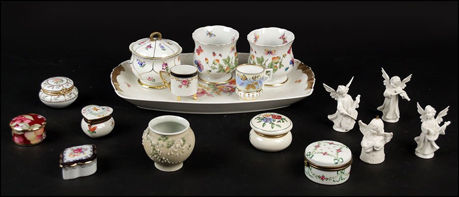 A COLLECTION OF PORCELAIN TABLE ARTICLES.: A COLLECTION OF PORCELAIN TABLE ARTICLES. Comprised of a Meissen covered sugar bowl, a tray with two matching bowls, two demitasse cups, and six porcelain covered boxes. Together with four porcelain a