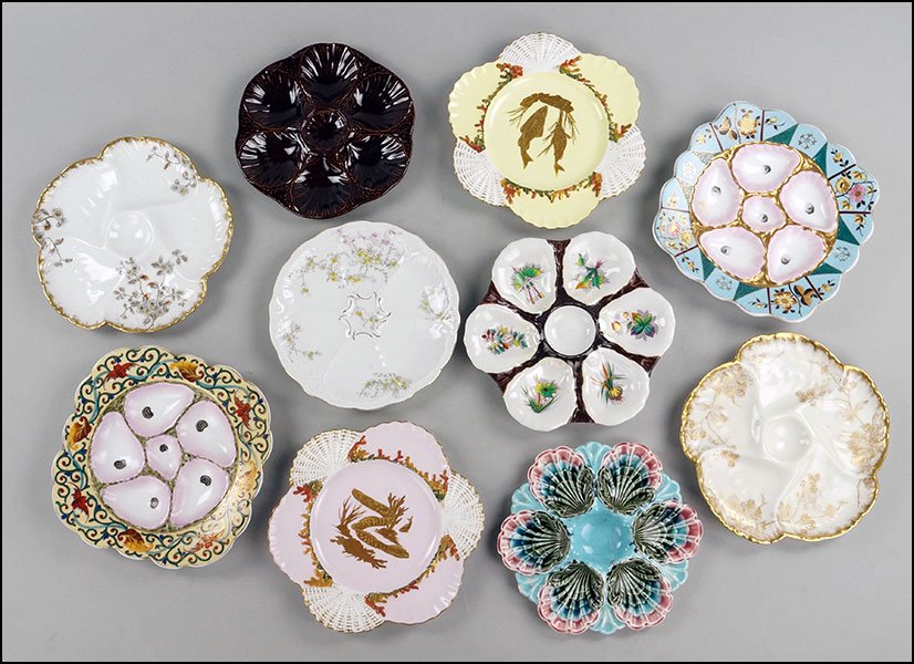 EIGHT PORCELAIN OYSTER PLATES.: EIGHT PORCELAIN OYSTER PLATES. Comprised of a Fischer and Mieg hand painted, a Mark Gutherz hand painted, two majolica, two Limoges, and a unmarked hand painted plate. Together with two Richard Briggs