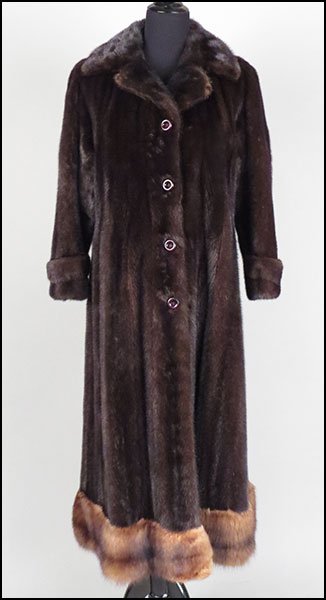 A MAHOGANY MINK 3/4 LENGTH COAT.: A MAHOGANY MINK 3/4 LENGTH COAT. Sweep is entirely trimmed in sable. Labeled "Reckmeyer's Furriers Milwaukee" Approximately size: 4-6
