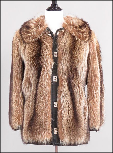 A RACCOON AND BLACK LEATHER JACKET.: A RACCOON AND BLACK LEATHER JACKET. Bearing twist toggle closure. Labeled "Greenblatt's, Fort Wayne, Indiana" Size unlabeled // Approximately a US 4/6