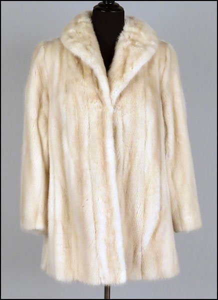 A PEARL MINK CAR COAT.: A PEARL MINK CAR COAT. With interior cinch waist option. Lined in a silk satin animal print