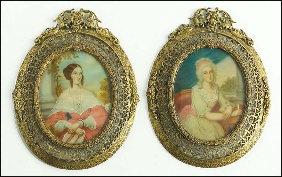 TWO CONTINENTAL SCHOOL PORTRAIT MINIATURES OF SEATED: TWO CONTINENTAL SCHOOL PORTRAIT MINIATURES OF SEATED LADIES IN DRESS. By the same artist. In matching gilt metal filigree frames. Signed illegibly 'I. Habey' on both Frame: 5.75'' x 4.25''