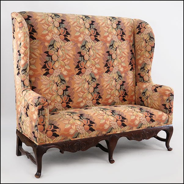 A LATE 19TH CENTURY CARVED OAK HIGHBACK SETTEE.: A LATE 19TH CENTURY CARVED OAK HIGHBACK SETTEE. Bearing a tapestry upholstery 56" x 60" x 23"