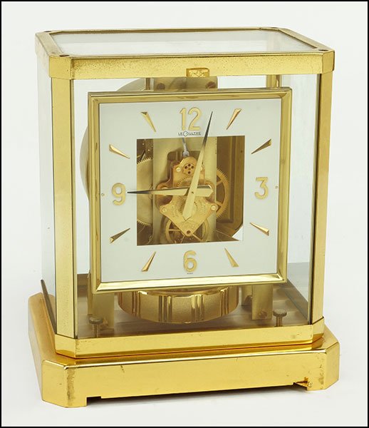 A JAEGER-LECOULTRE BRASS ATMOS MANTLE CLOCK.: A JAEGER-LECOULTRE BRASS ATMOS MANTLE CLOCK. Stamped en verso, 'Swiss' on the face Case: 9" x 8" x 6.5"