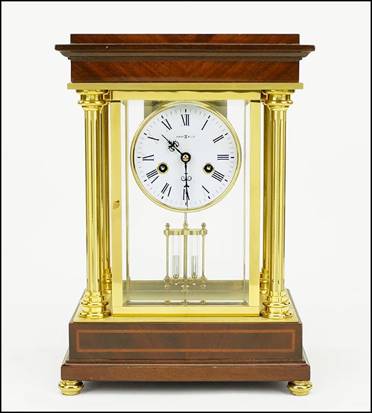 A HOWARD MILLER SHELF CLOCK.