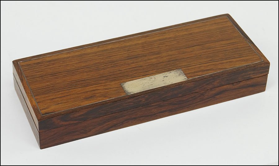 A HANS HANSEN ROSEWOOD BOX.: A HANS HANSEN ROSEWOOD BOX. Inlaid with sterling silver. Interior of box opens to reveal two compartments which are intended for playing cards. Underside bears an inset round plaque reading "925 S Han