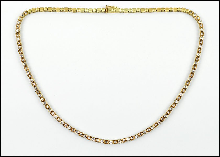 A PENNY PREVILLE DIAMOND AND 18 KARAT YELLOW GOLD: A PENNY PREVILLE DIAMOND AND 18 KARAT YELLOW GOLD NECKLACE. Comprising 85 diamonds set in alternating square and circle settings. Diamonds are VS clarity, G-H color and total approximately 2.00 carats