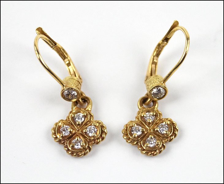 A PAIR OF JUDITH RIPKA DIAMOND AND 18 KARAT YELLOW GOLD: A PAIR OF JUDITH RIPKA DIAMOND AND 18 KARAT YELLOW GOLD CLOVER DROP EARRINGS. Leverback earring contains one round bezel set diamond suspended from which is a clover form drop containing four round di