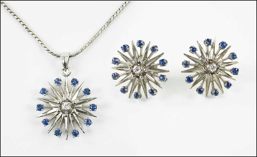A PAIR OF DIAMOND, SAPPHIRE, AND 14 KARAT WHITE GOLD: A PAIR OF DIAMOND, SAPPHIRE, AND 14 KARAT WHITE GOLD EARRINGS. Comprising a spray form pendant and pair of screwback earrings. Each contains ten round sapphires and one central round diamond. Together