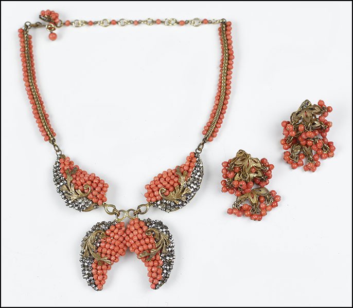 A MIRIAM HASKELL FAUX CORAL BEAD AND GOLDTONE: A MIRIAM HASKELL FAUX CORAL BEAD AND GOLDTONE DEMI-PARURE. Comprising a necklace and pair of earclips Necklace Length: 16"
