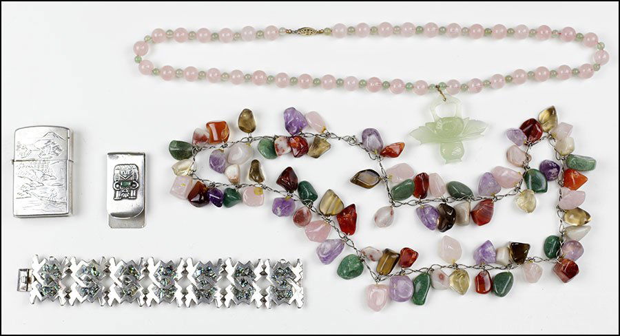 A CARVED JADE AND ROSE QUARTZ BEAD NECKLACE.: A CARVED JADE AND ROSE QUARTZ BEAD NECKLACE. Together with a smei-precious stone necklace, a Mexican sterling silver and abalone bracelet, a Colombian sterling silver money clip, and a Japanese sterli