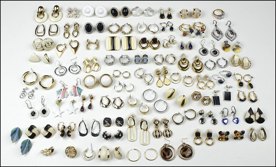 A COLLECTION OF SIGNED AND UNSIGNED EARRINGS AND: A COLLECTION OF SIGNED AND UNSIGNED EARRINGS AND EARCLIPS. Comprising goldtone and silvertone postback and leverback earrings and earclips. Signed pieces include Monet, Napier, Swarovski, and other