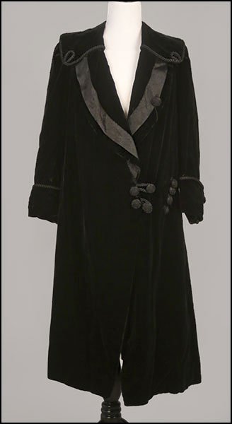 A VICTORIAN STYLE BLACK VELVET OVERCOAT.: A VICTORIAN STYLE BLACK VELVET OVERCOAT. Lined. Bearing a 'TH Marshall Dressmaker & Milliner Worthing' label. With embellished collar work Size unlabeled
