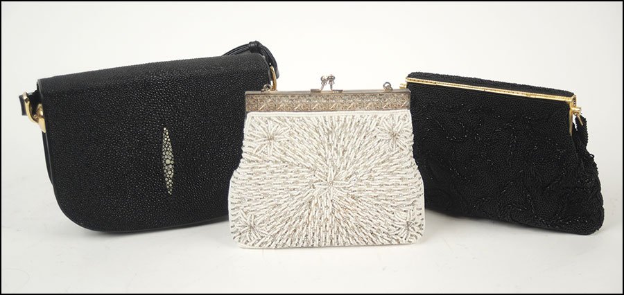 A BLACK SHAGREEN HANDBAG.: A BLACK SHAGREEN HANDBAG. Together with a black beaded evening bag and a white beaded evening bag