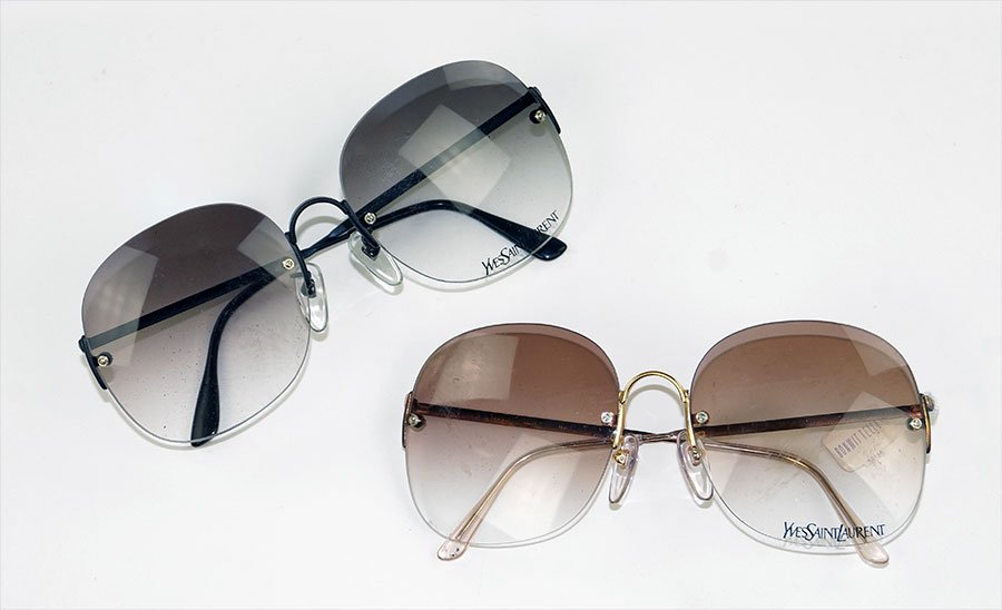 TWO PAIRS OF YVES SAINT LAURENT SUNGLASSES.: TWO PAIRS OF YVES SAINT LAURENT SUNGLASSES.