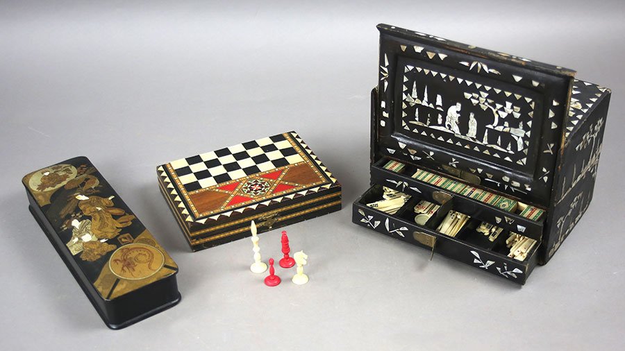 A Chinese Bone Ma Jong Game.: A Chinese Bone Ma Jong Game. Contained within a mother-of-pearl inlaid box. Together with a traveling chess game and a Japanese lacquered glove box measuring 12"