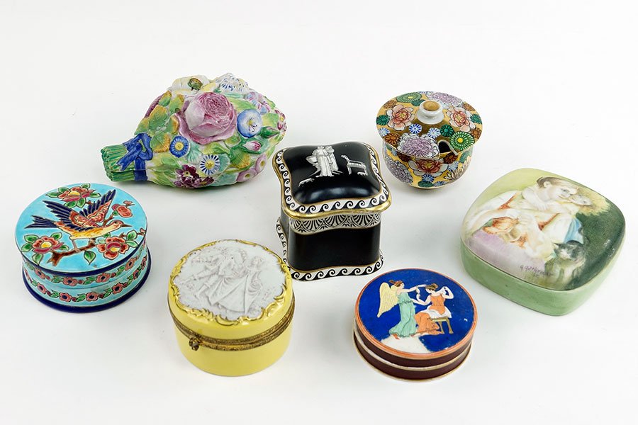 A Collection of Porcelain Boxes.: A Collection of Porcelain Boxes. Comprising a French majolica Emaux Longwy box, a Westhead and Moore round box, a German yellow porcelain box with white porcelain lid, a Japanese round box, a black an
