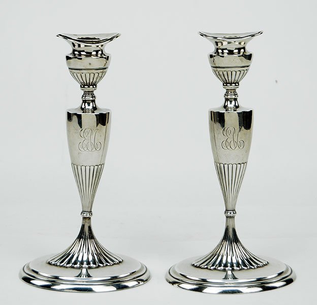 A Pair Of Weighted Sterling Silver Candlesticks. (1 of 1)