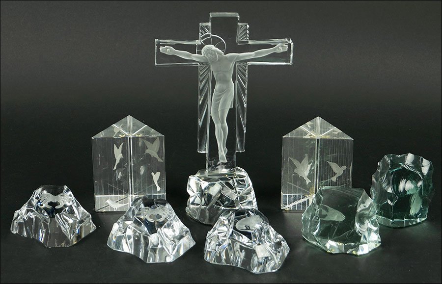 A Baccarat Crystal Crucifix.: A Baccarat Crystal Crucifix. Together with two Lindstrand for Kosta triangular glass decorative items, three Val St. Lambert glass decorative items, and two Kosta glass decorative items with fish engr