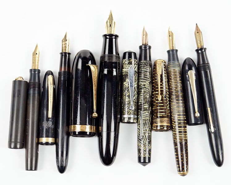 A Collection Of Six Fountain Pens.: A Collection Of Six Fountain Pens. Comprising one Sheaffer's fountain pen with 14 karat yellow gold nib, one Waterman pen, one Parker pen, and three additional black barreled pens
