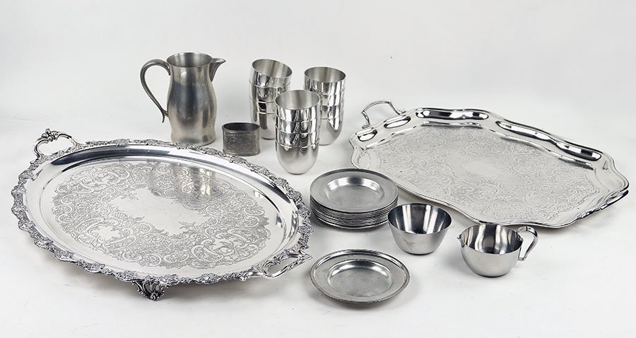 A Georg Jensen Stainless Steel Creamer And Sugar.: A Georg Jensen Stainless Steel Creamer And Sugar. Together with two silverplate serving trays, a pewter pitcher, twelve Kirk Stieff pewter cups, twelve pewter saucers, and one additional pewter cup de