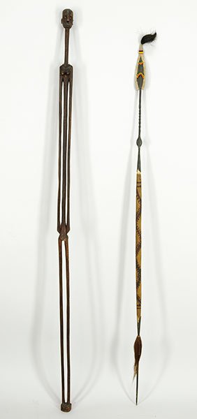 An African Ceremonial Spear.: An African Ceremonial Spear. Together with an African carved wood figural dancing stick (height: 65"). Spear is composed of wood and metal and is decorated with fur, animal hair, and beads Spear: 60"
