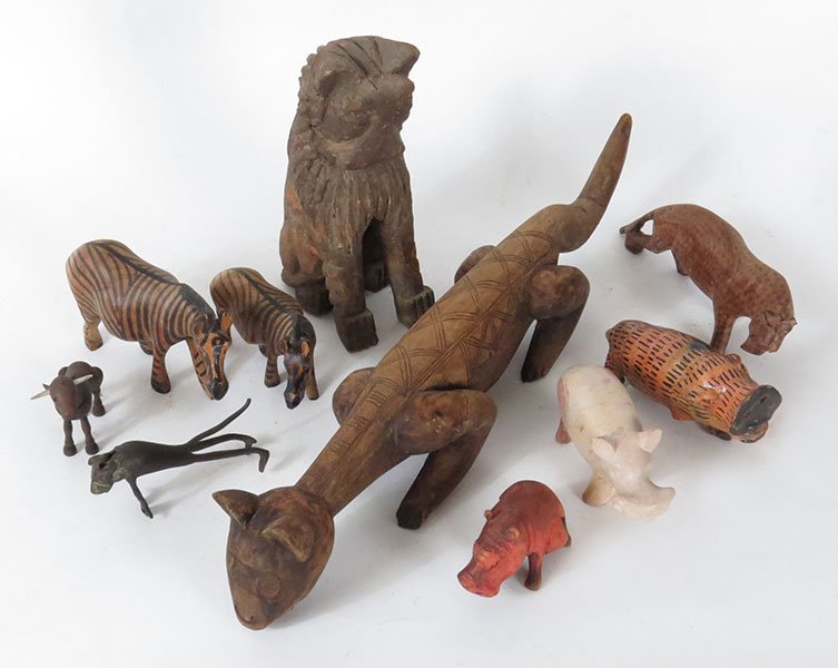 A Collection of Carved Wood African Animals.: A Collection of Carved Wood African Animals. Depicting a zebra, hippo, leopard and a metal standing animal Longest: 22.5" x 4.5" x 4"