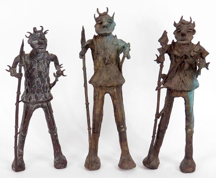 A Collection of Three African Metal Warrior Sculptures.: A Collection of Three African Metal Warrior Sculptures. Depicting warrior figures carrying weapons Tallest: 16.5"