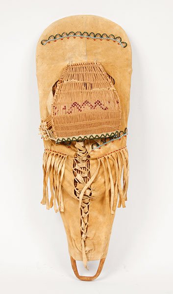 A 20th Century Native American Reed and Hide: A 20th Century Native American Reed and Hide Cradleboard. Soft hide with fringe and reed back and face cover. From the Native American collection of Ralph Edward Guy who was listed in Who's Who in Ame