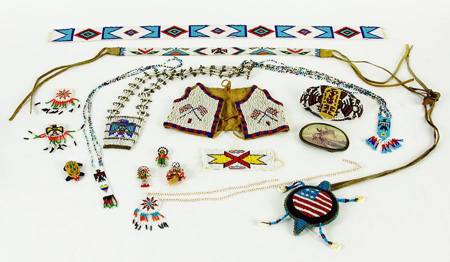 A Collection of Beaded Fetish and Necklaces.: A Collection of Beaded Fetish and Necklaces. A turtle fetish necklace. Together with other beaded pieces, doll beaded vest and necklaces from the 1970's souvenir trade stores. From the Native American