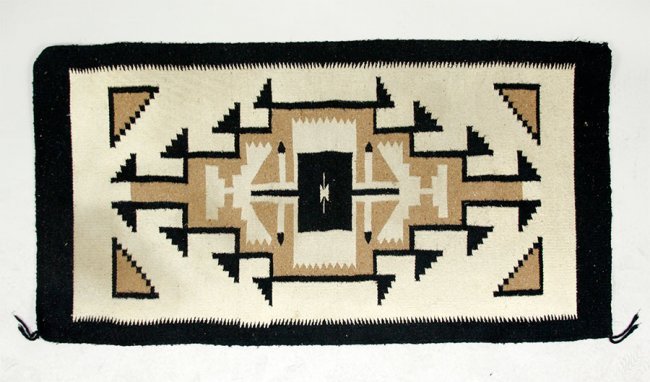 A Native American Navajo Two Grey Hill Rug: A Native American Navajo Two Grey Hill Rug. A tight weave in browns, tans and black, from the Native American collection of Ralph Edward Guy who was listed in Who\'s Who in American Indian Relics Leng