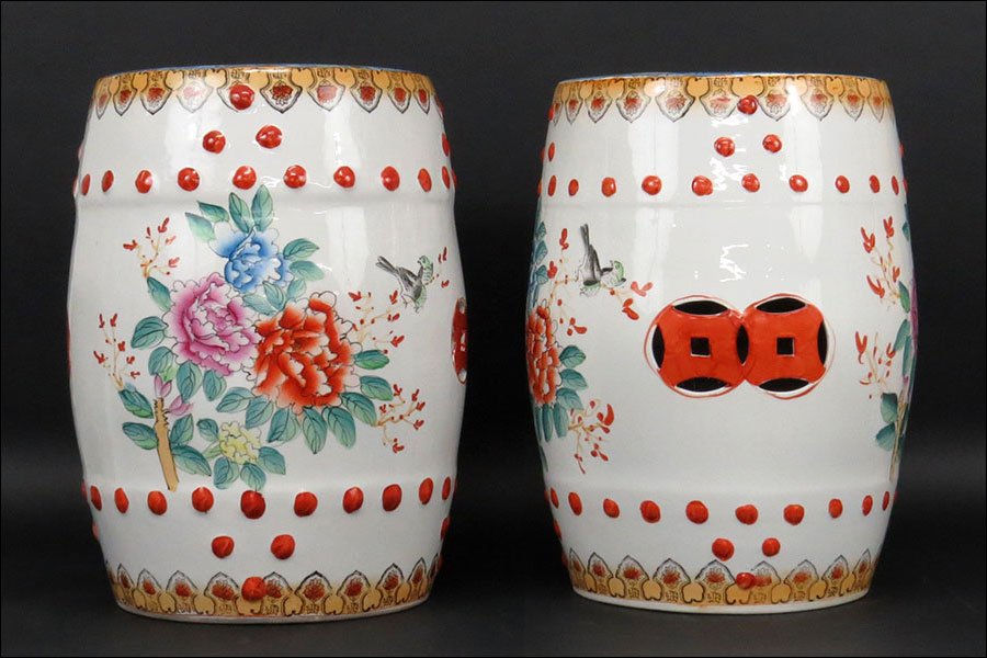A Pair of Chinese Painted Ceramic Garden Seats.: A Pair of Chinese Painted Ceramic Garden Seats. Bearing a bird and foliate motif 18" x 13"