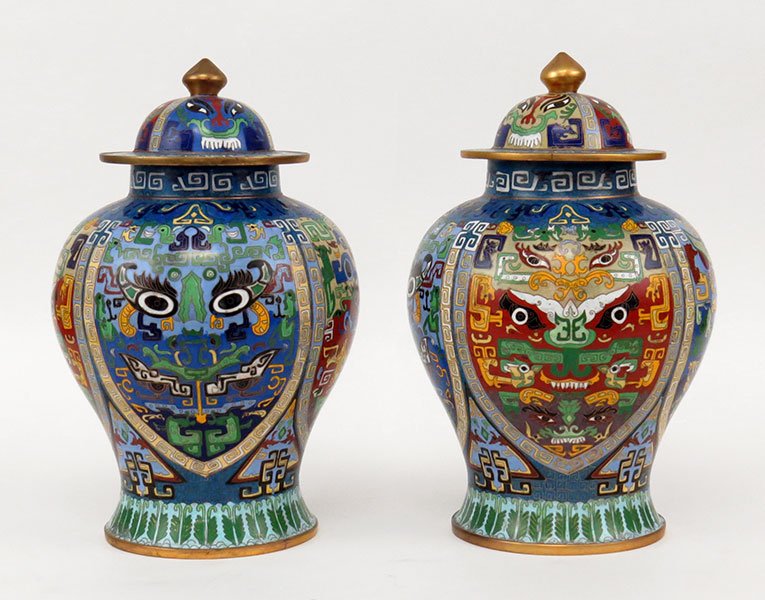 A Pair of Chinese Cloisonne Ginger Jars with Lids.: A Pair of Chinese Cloisonne Ginger Jars with Lids. Blue ground with a multicolor dragon face and Greek key pattern. Bearing character marks on the undersides 15" x 10"