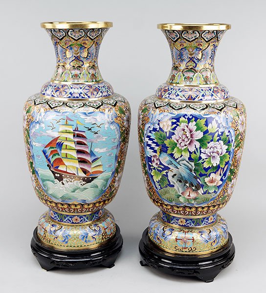 A Pair of Chinese Cloisonne and Champleve Urns.: A Pair of Chinese Cloisonne and Champleve Urns. Each bearing a central medallion depicting a clipper ship and decorated with foliate, chrysanthemum, and phoenix motif Each: 25.5" x 11.5"