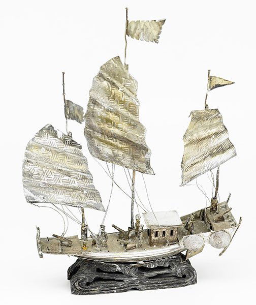A Chinese Silver Boat.: A Chinese Silver Boat. Three mast, with figures throughout. Mounted to a wood base Overall: 10.5" x 8" x 1.5" Weight: 7.00 ozt